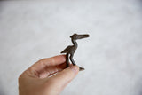 Collectible vintage African dark bronze stork held in hand.