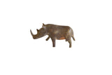 Vintage handmade African bronze rhino with a thin nose and dark, weathered patina.