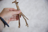 Textured bronze legs and feet of the vintage African giraffe sculpture with light patina.
