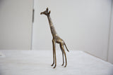 Dark bronze vintage African giraffe sculpture with golden streaked patina and etched details.