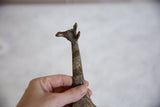 Handmade dark bronze giraffe head, textured with golden streaks.
