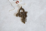 Vintage African bronze pendant showing its unique sea creature form and handmade texture.