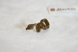 Rough, hand-cast texture of a coiled vintage African bronze snake ring.