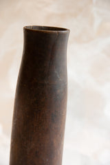 Detail of the handmade wooden vase's rim showing aged character and fine cracks.