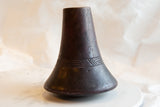Antique African wooden vase with dark, patinated surface and geometric carved band.