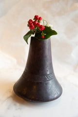 Antique African wooden vase, dark wood, with carved geometric bands and red berries.