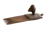 Antique African wooden bird comb or hair pick, hand-carved with bird head handle.