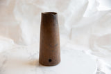 Aged brown wood, rough rim, and prominent vertical crack on the antique wooden vase.