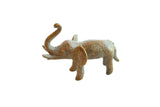 Vintage handmade African oxidized bronze elephant, trunk up, showing golden patina.