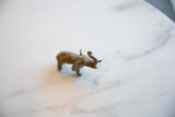 Vintage African bronze elephant sculpture, profile view of its textured patina.