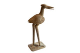 Vintage African large bronze stork figurine with textured, time-softened patina.