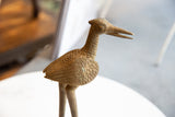 Textured bronze body and sculpted wing of a vintage African stork.