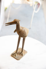 Textured bronze stork back and wing, showcasing intricate feather details and patina.