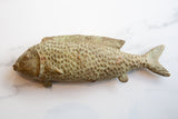 Vintage African bronze fish with textured scales and time-softened green-brown patina.