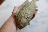Vintage African bronze fish, close-up of head and scales with rich green patina.