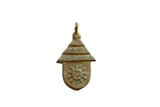 Vintage African oxidized bronze pendant shaped like a hut with a textured roof and sun design.