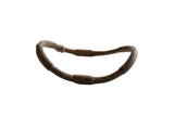 Antique African bronze curved artifact, handmade with dark, aged patina.