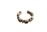 Antique African silver cuff bracelet with a linked geometric design and aged patina.