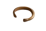 Antique African bronze snake cuff bracelet with a warm, aged gold patina.