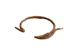 Antique African iron antelope bracelet with rich patina and unique handmade texture.