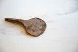 Vintage African iron utensil showing its unique rustic texture and rich rust patina.