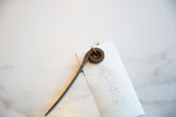 Close-up of the rustic, coiled head on the vintage African iron pick.