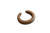 Antique African bronze snake cuff bracelet with a weathered patina and incised details.