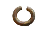 Antique African copper and bronze bracelet with an aged patina and spiral barber pole design.