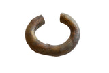 Antique African copper and bronze cuff bracelet with a heavy, time-worn patina and incised details.