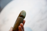 Close-up view of the antique bronze bracelet's handcrafted seam and rustic patina.