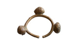Vintage African Bronze Lobi Bell Cuff Bracelet with three bell ornaments and aged patina.