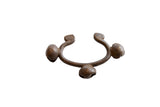 Vintage Lobi bronze cuff bracelet with three bell adornments showing a rich, dark patina.