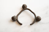 A collectible African Lobi cuff bracelet showing the aged bronze texture and unique bell shape.
