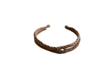 Collectible antique African iron cuff bracelet with double twisted bands and rich brown patina.