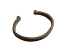 Antique African bronze double-banded cuff bracelet with a dark aged patina and scrolled ends.