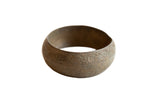 Antique handmade African bronze bracelet with an etched floral design and a light patina.