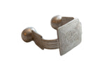 Antique African aluminum cuff bracelet with a large square face and etched geometric details.