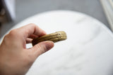 Handcrafted texture and aged golden patina on the antique bronze stripe cuff.
