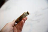 Side profile of the handmade African bronze cuff, showing its solid build and aged patina.