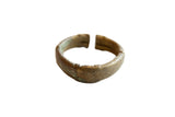 Antique African oxidized bronze cuff bracelet with a hand-worked stripe design and rich patina.
