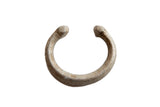 Antique African aluminum snake cuff bracelet with a weathered, textured patina.