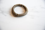 The dimensional form and rich, textured patina of a collectible antique African bronze cuff.