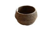 Antique African bronze alloy wide cuff bracelet with faded detailing and aged patina.