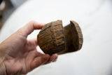 Side profile of an antique African metal cuff, showing its substantial form and rustic patina.