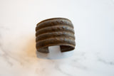 Antique African bronze cuff with distinct geometric motifs and rich patina.