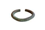 Antique African oxidized copper cuff with a rich green patina and fine striped detailing.