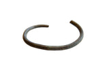 Handmade antique African bronze cuff bracelet with a rich, dark oxidized patina.