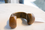 Handcrafted geometric etchings and deep, aged patina on the vintage African copper alloy cuff.