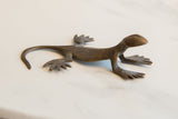 Handmade dark bronze gecko sculpture with aged patina and textured body.