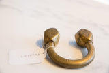 The aged gold patina on a collectible African bronze Tuareg cuff.